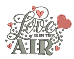 Machine embroidered motto Love is
in the Air with silver and red hearts