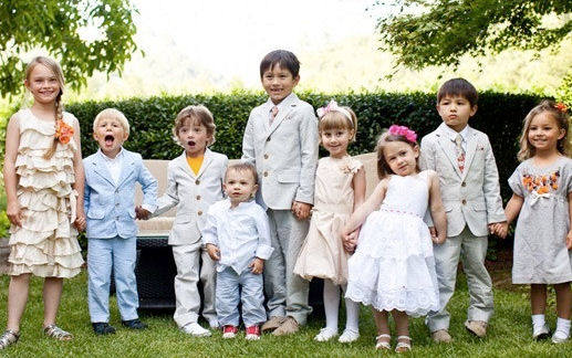 Group of children of assorted ages dressed in
their best