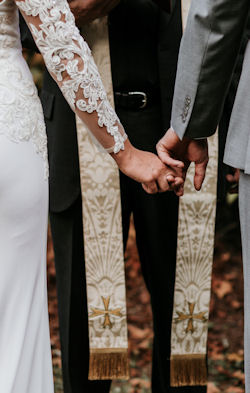 Clergy person with Christian Stole marrying
a couple
