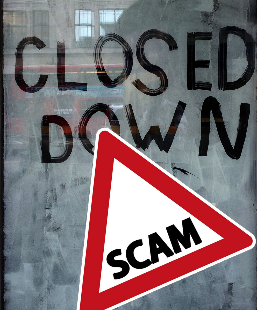 Closed Down written on a blanked out window
With Scam Alert sign