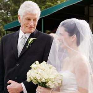 Father escorting
                          bride down the aisle