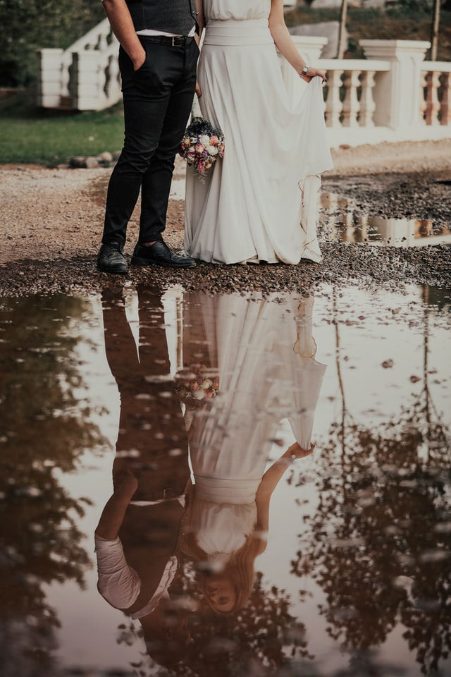 Marrying couple
reflected in water